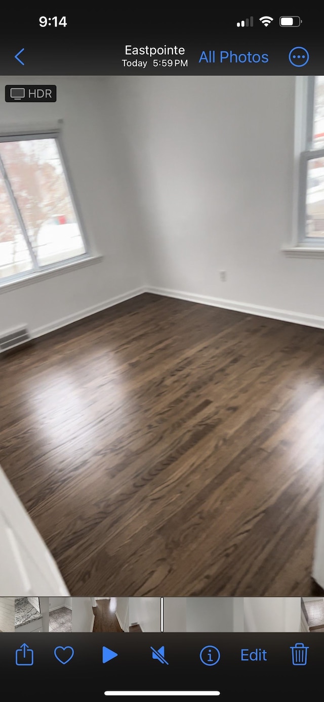 22131 Nevada Ave, Eastpointe, MI 48021 - empty room featuring visible vents, baseboards, and wood finished floors