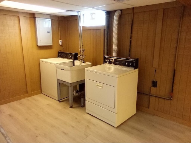 22131 Nevada Ave, Eastpointe, MI 48021 - clothes washing area with electric panel, laundry area, independent washer and dryer, and light wood-style flooring