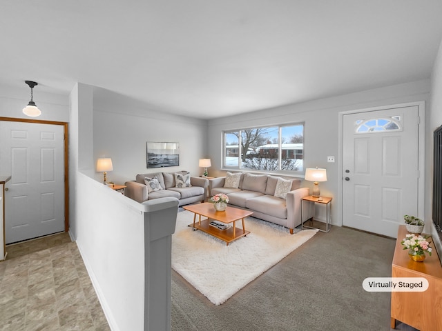 living area featuring baseboards