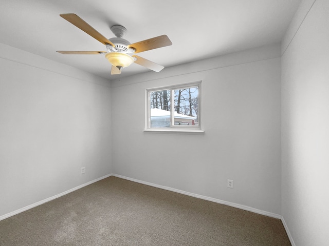carpeted empty room with baseboards and ceiling fan
