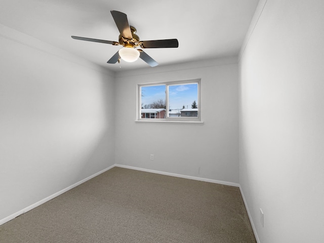 empty room featuring baseboards, ceiling fan, and carpet floors