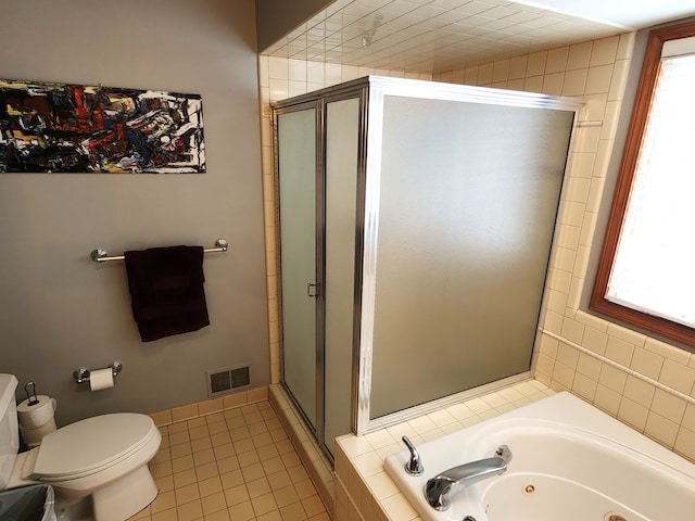 full bathroom featuring toilet, visible vents, a stall shower, tile patterned flooring, and a jetted tub