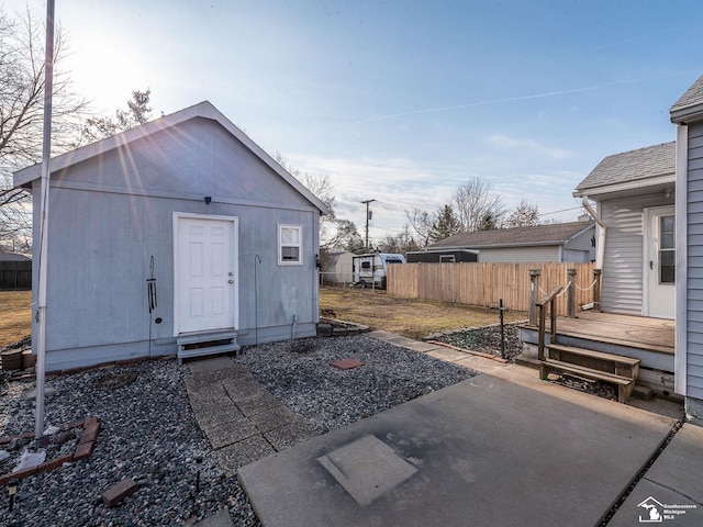 view of outbuilding featuring an outbuilding and fence