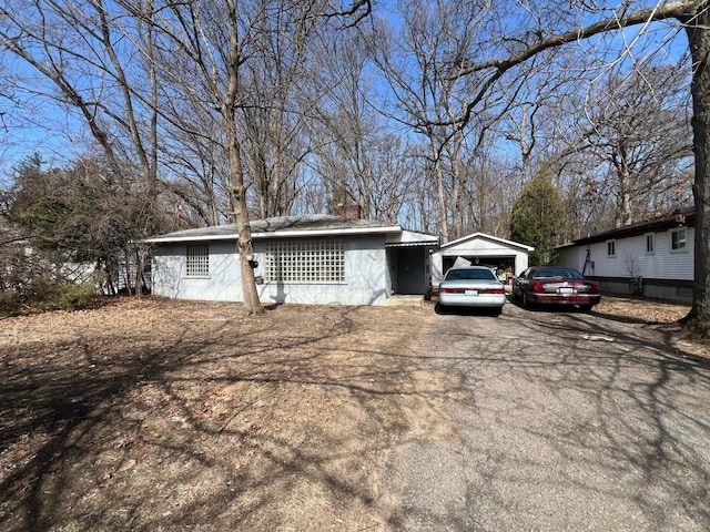 view of front of home with a detached garage