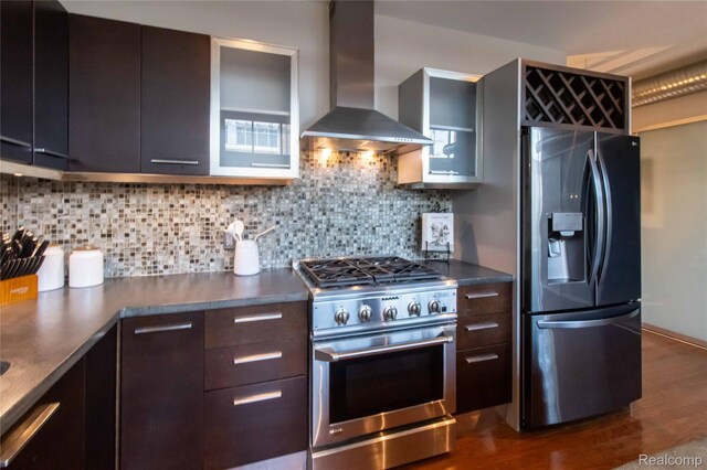 100 N Center St Unit 302, Royal Oak, MI 48067 - kitchen featuring refrigerator with ice dispenser, high end stainless steel range, wall chimney range hood, dark countertops, and dark wood finished floors