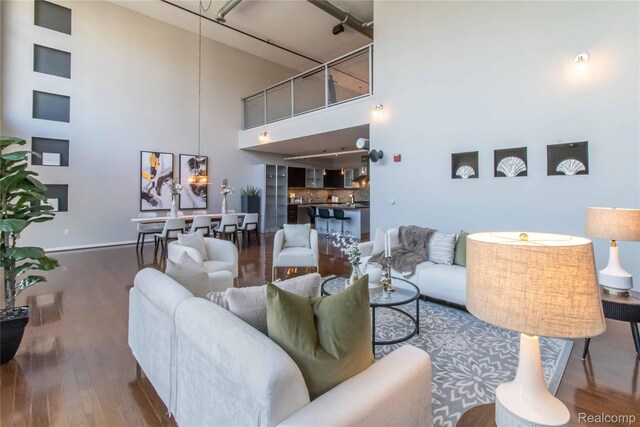 100 N Center St Unit 302, Royal Oak, MI 48067 - living room with a towering ceiling and wood finished floors