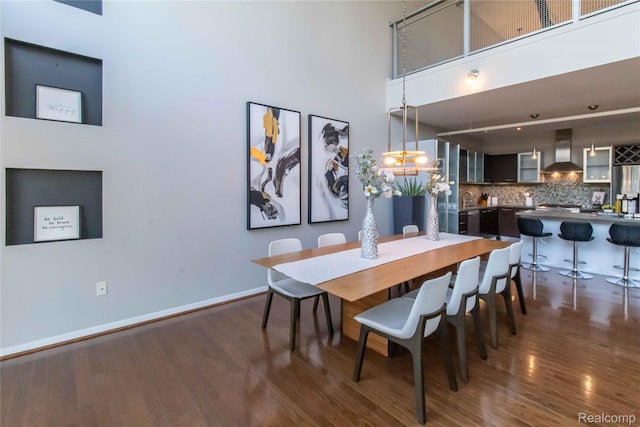 100 N Center St Unit 302, Royal Oak, MI 48067 - dining area with wood finished floors and a high ceiling