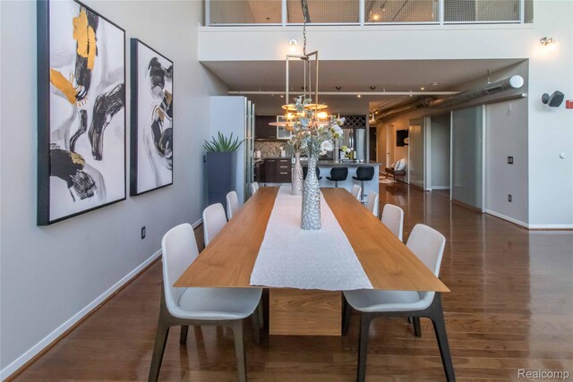 100 N Center St Unit 302, Royal Oak, MI 48067 - dining space with wood finished floors and a chandelier