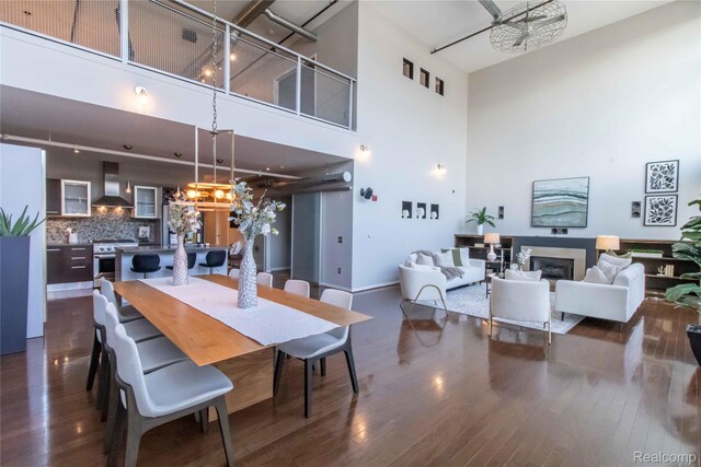 100 N Center St Unit 302, Royal Oak, MI 48067 - dining room with a towering ceiling, dark wood-style floors, and a chandelier