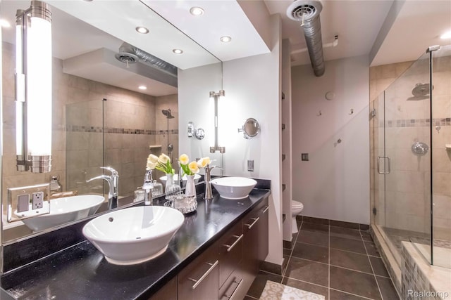 100 N Center St Unit 302, Royal Oak, MI 48067 - full bathroom featuring a stall shower, tile patterned floors, double vanity, and recessed lighting