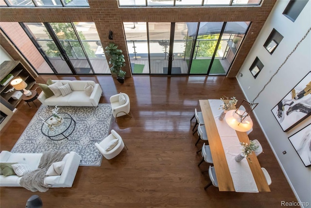 100 N Center St Unit 302, Royal Oak, MI 48067 - living area featuring wood finished floors and a towering ceiling