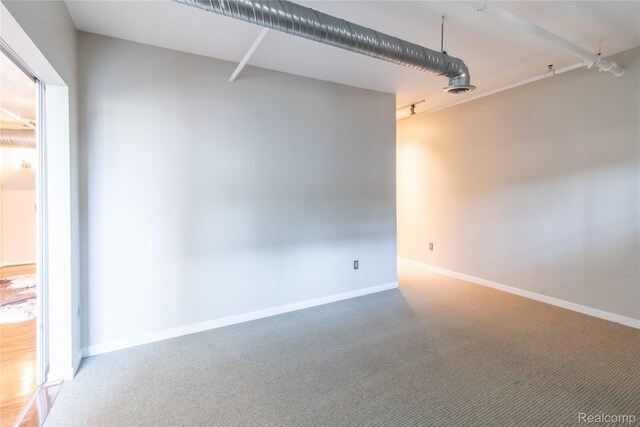 100 N Center St Unit 302, Royal Oak, MI 48067 - spare room with carpet