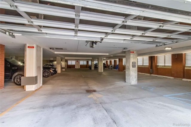 100 N Center St Unit 302, Royal Oak, MI 48067 - parking garage featuring a garage door opener