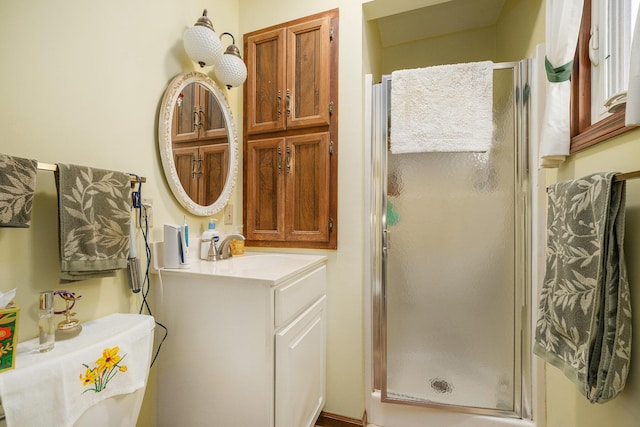 full bathroom with vanity and a stall shower