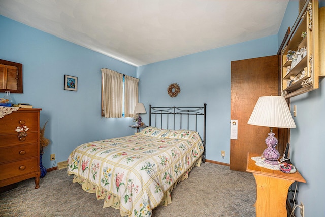 bedroom with carpet and baseboards