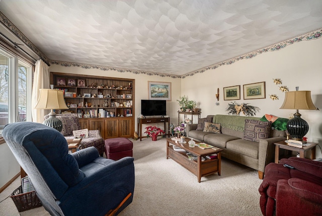 carpeted living room featuring a textured ceiling