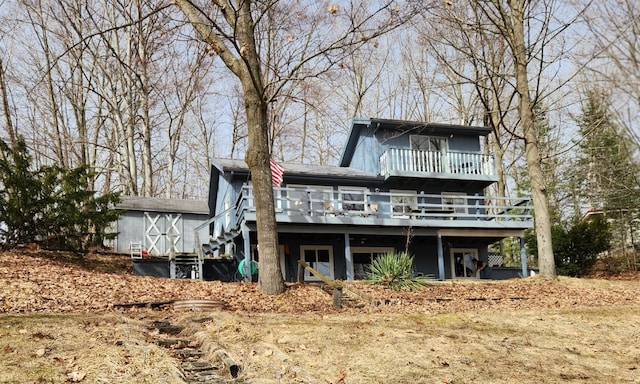 7461 White Birch Dr, Farwell, MI 48622 - back of property featuring a wooden deck and stairs