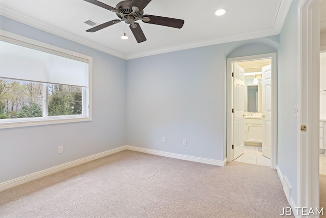 6579 Partridge Ln, Holland, MI 49423 - unfurnished bedroom with light colored carpet, ornamental molding, baseboards, recessed lighting, and connected bathroom