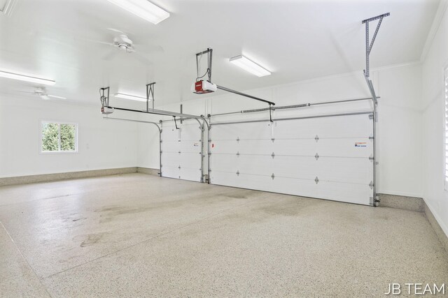 6579 Partridge Ln, Holland, MI 49423 - garage with a garage door opener, a ceiling fan, and baseboards