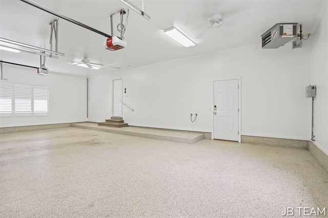 6579 Partridge Ln, Holland, MI 49423 - garage with a garage door opener and baseboards