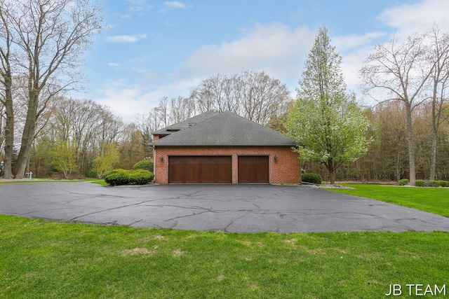 6579 Partridge Ln, Holland, MI 49423 - garage with asphalt driveway