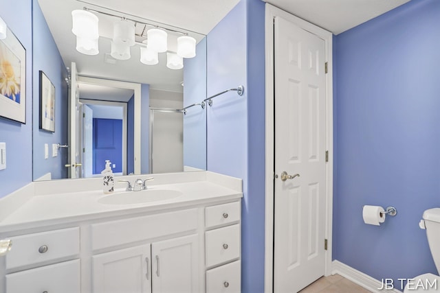 6579 Partridge Ln, Holland, MI 49423 - bathroom with toilet, vanity, tile patterned flooring, and a shower with shower door