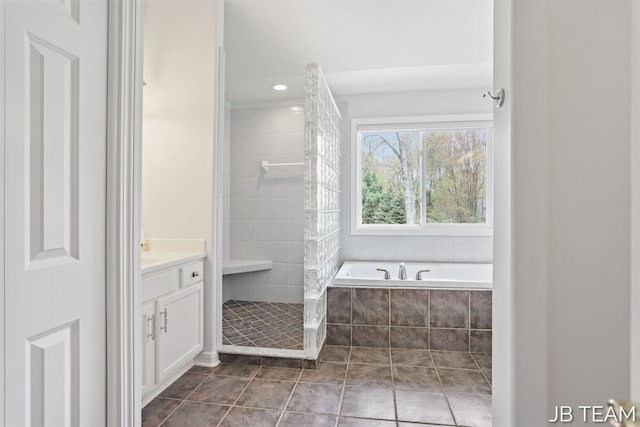 6579 Partridge Ln, Holland, MI 49423 - bathroom with a stall shower, vanity, tile patterned floors, a bath, and recessed lighting