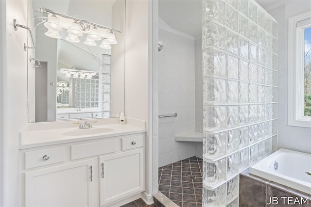 6579 Partridge Ln, Holland, MI 49423 - bathroom with walk in shower, a bath, and vanity