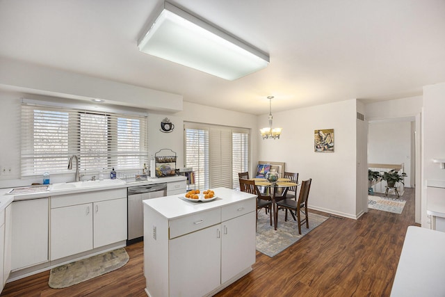 23930 Greenglen Ct, Franklin, MI 48025 - kitchen with a notable chandelier, a sink, dark wood-style floors, light countertops, and dishwasher