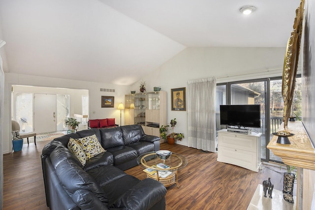 23930 Greenglen Ct, Franklin, MI 48025 - living area featuring visible vents, lofted ceiling, and dark wood-type flooring
