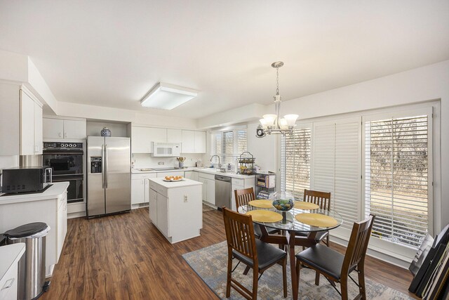 23930 Greenglen Ct, Franklin, MI 48025 - dining area featuring an inviting chandelier and dark wood-type flooring