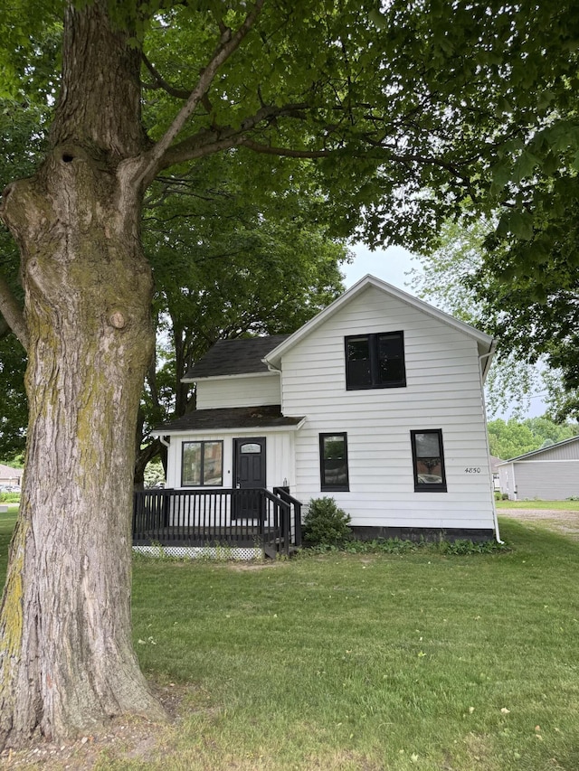 4850 136th Ave, Hamilton, MI 49419 - rear view of property featuring a wooden deck and a lawn
