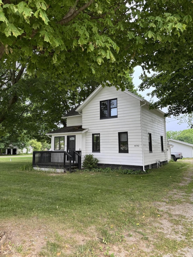 4850 136th Ave, Hamilton, MI 49419 - view of front of property with a front lawn and a wooden deck