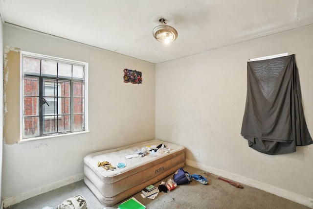 bedroom with carpet and baseboards