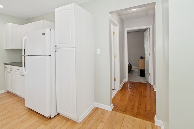 537 Andresen Ct, Hazel Park, MI 48030 - kitchen with freestanding refrigerator, light wood-style flooring, white cabinetry, baseboards, and recessed lighting