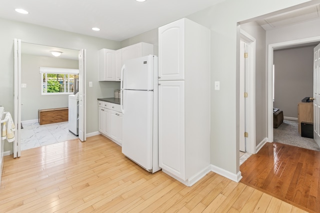 537 Andresen Ct, Hazel Park, MI 48030 - kitchen featuring freestanding refrigerator, white cabinetry, recessed lighting, washer / dryer, and light wood finished floors
