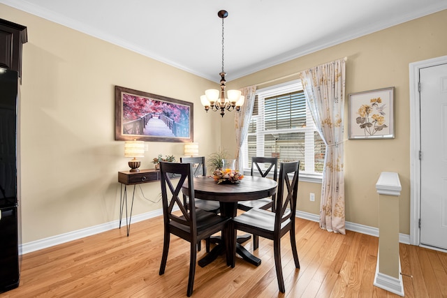 259 Victoria Dr, Dexter, MI 48130 - dining space with an inviting chandelier, light wood-style flooring, baseboards, and ornamental molding
