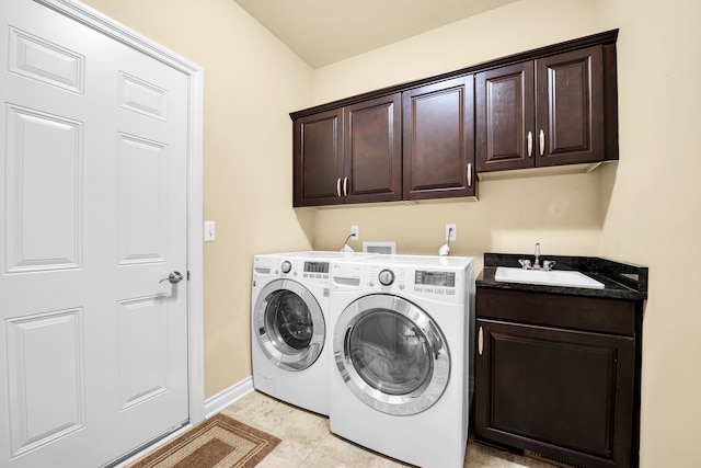 259 Victoria Dr, Dexter, MI 48130 - laundry area with baseboards, separate washer and dryer, a sink, and cabinet space