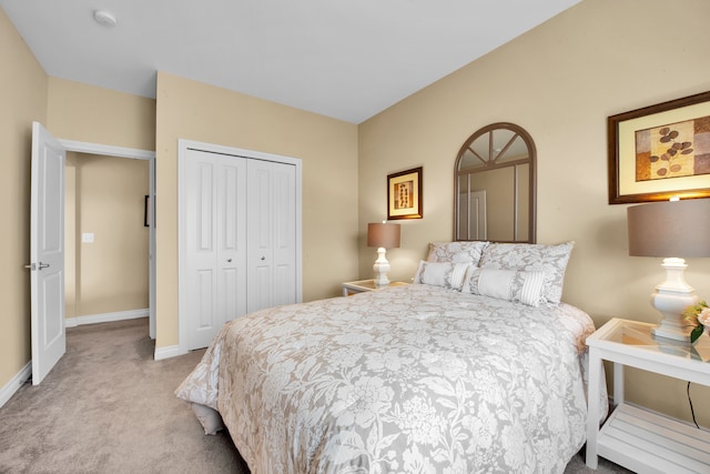 259 Victoria Dr, Dexter, MI 48130 - bedroom featuring carpet, a closet, and baseboards