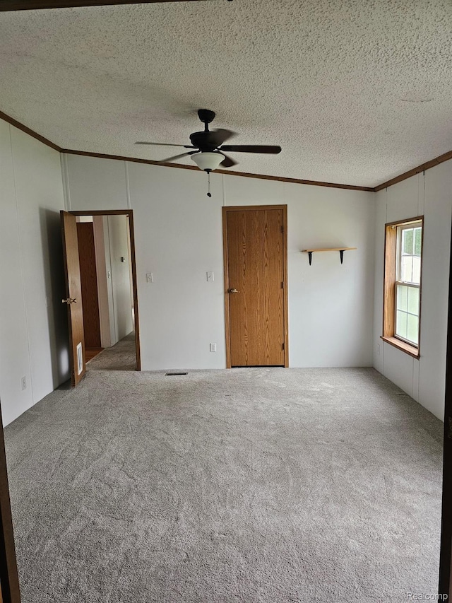 73 Grey Fox Ct, Grand Blanc, MI 48439 - unfurnished bedroom with crown molding, carpet flooring, a textured ceiling, and ceiling fan