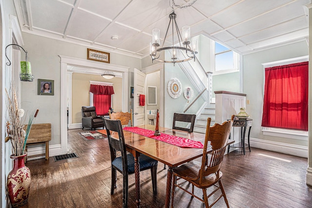 28 Orchard Pl, Battle Creek, MI 49017 - dining area featuring coffered ceiling, baseboards, an inviting chandelier, and hardwood / wood-style flooring