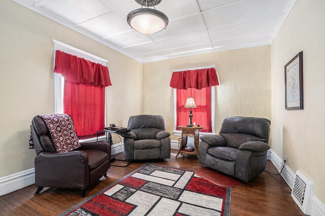 28 Orchard Pl, Battle Creek, MI 49017 - living area with visible vents, baseboards, hardwood / wood-style floors, and a baseboard heating unit