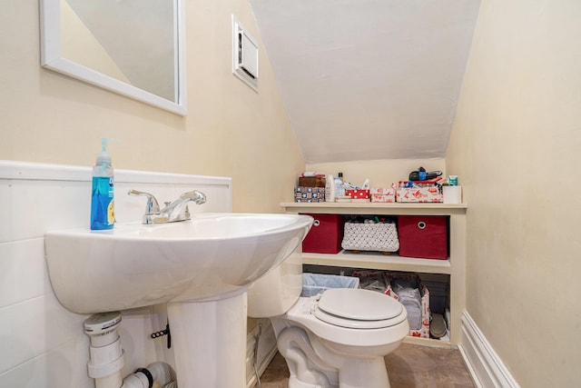 28 Orchard Pl, Battle Creek, MI 49017 - bathroom with lofted ceiling and toilet