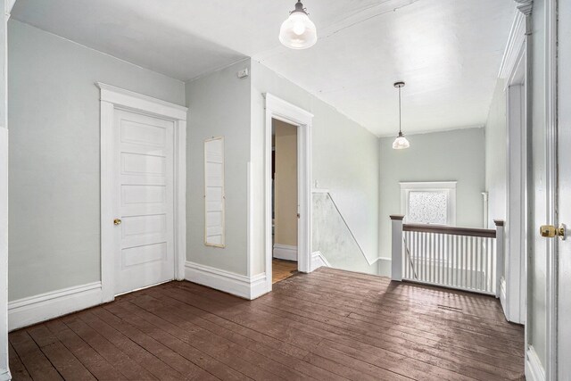 28 Orchard Pl, Battle Creek, MI 49017 - empty room with baseboards and dark wood-type flooring