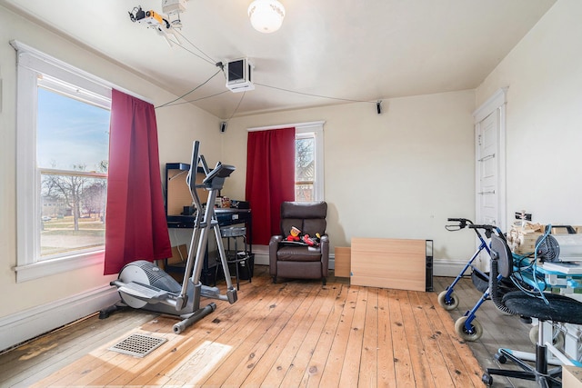 28 Orchard Pl, Battle Creek, MI 49017 - exercise room with visible vents, wood-type flooring, and baseboards