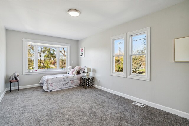 bedroom with visible vents, baseboards, and carpet flooring