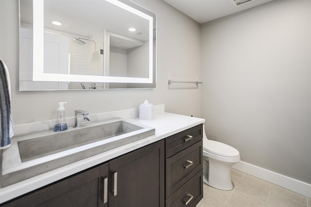 full bathroom featuring toilet, recessed lighting, tile patterned flooring, baseboards, and vanity
