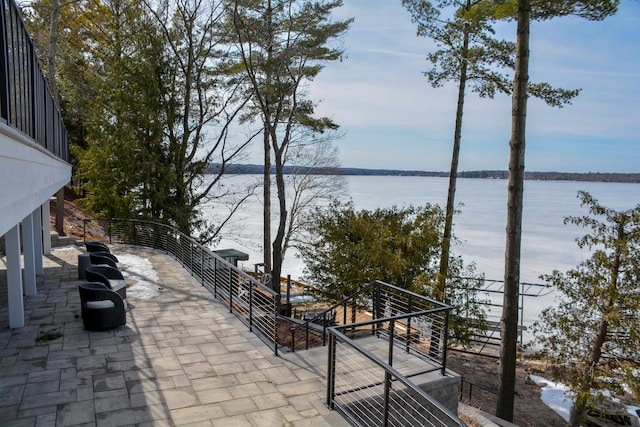 view of patio featuring a water view