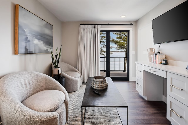 sitting room featuring dark wood-style floors and recessed lighting