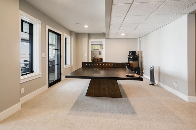 exercise room featuring recessed lighting, baseboards, a paneled ceiling, and carpet